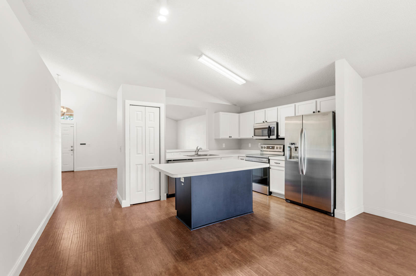 kitchen with island and white cabinets